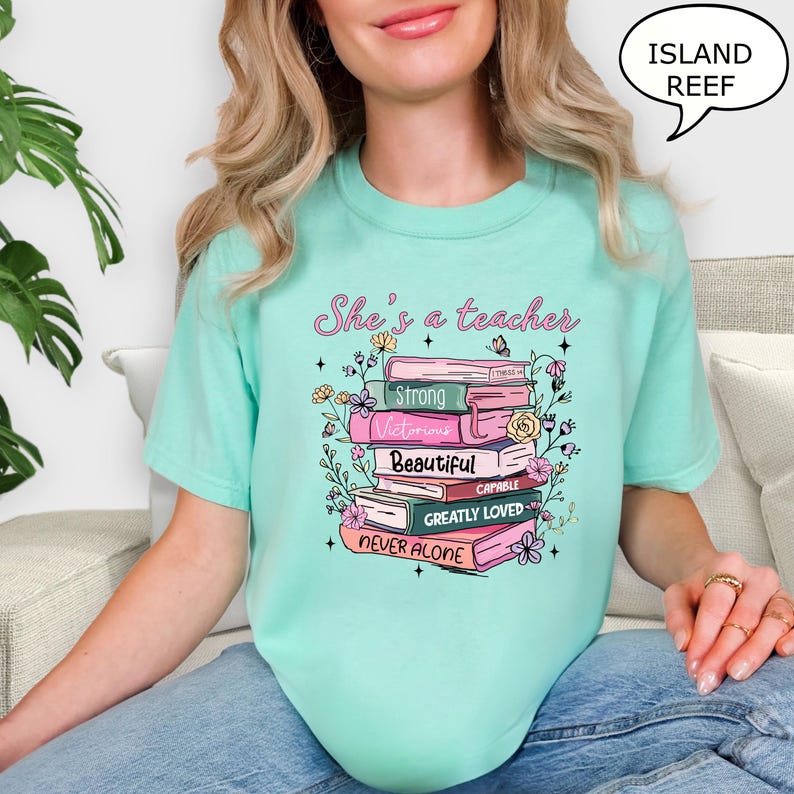 Comfort Colors® She's A Teacher T-Shirt, Book Teacher Shirt, Teacher Gift, Graduation Gift, Teacher School Shirt, Floral Teacher Shirt